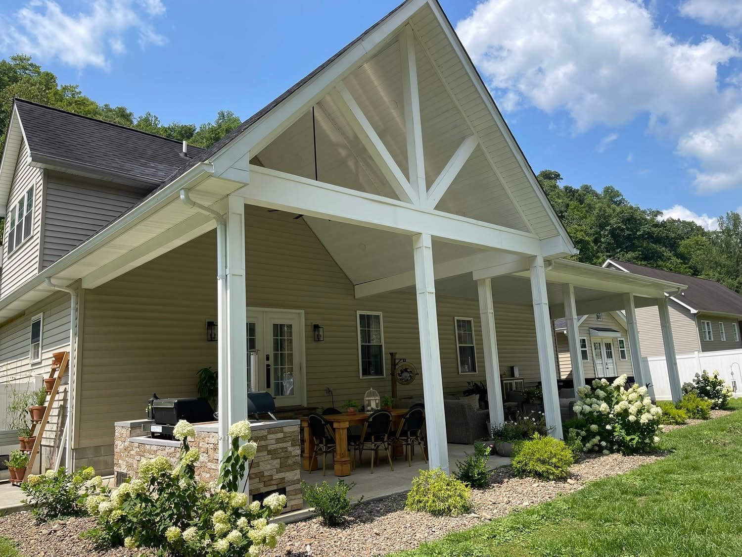 Custom covered porch with vaulted ceiling built by Premier Builders